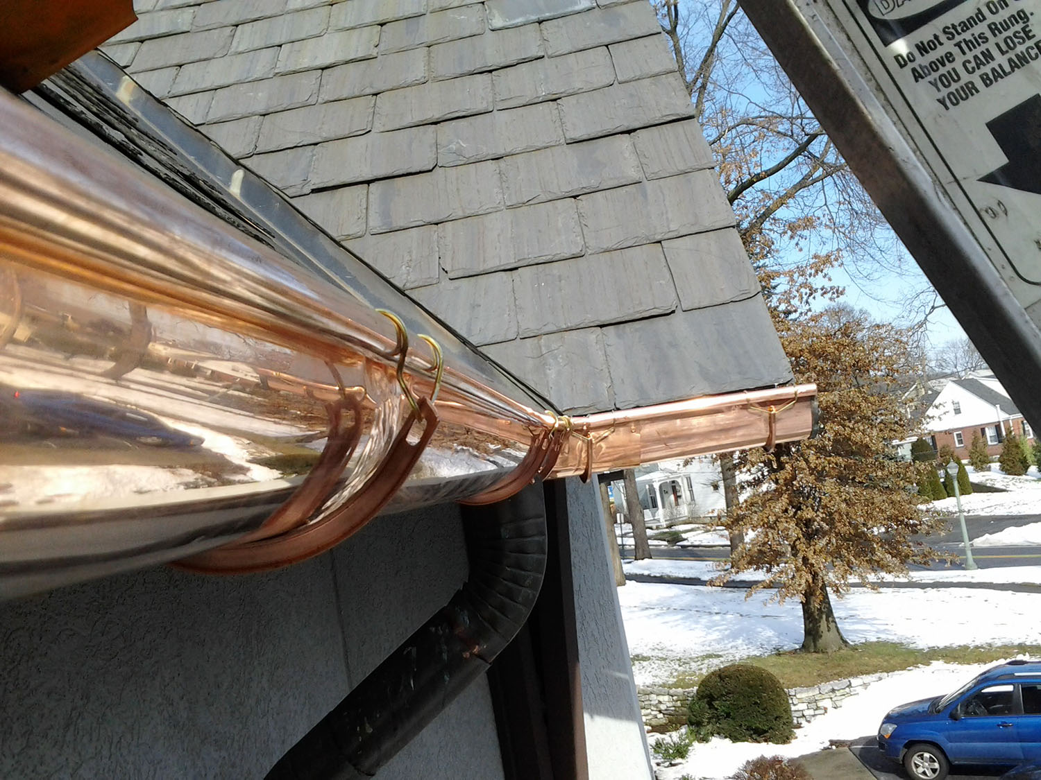 Half-round copper gutters installation detail