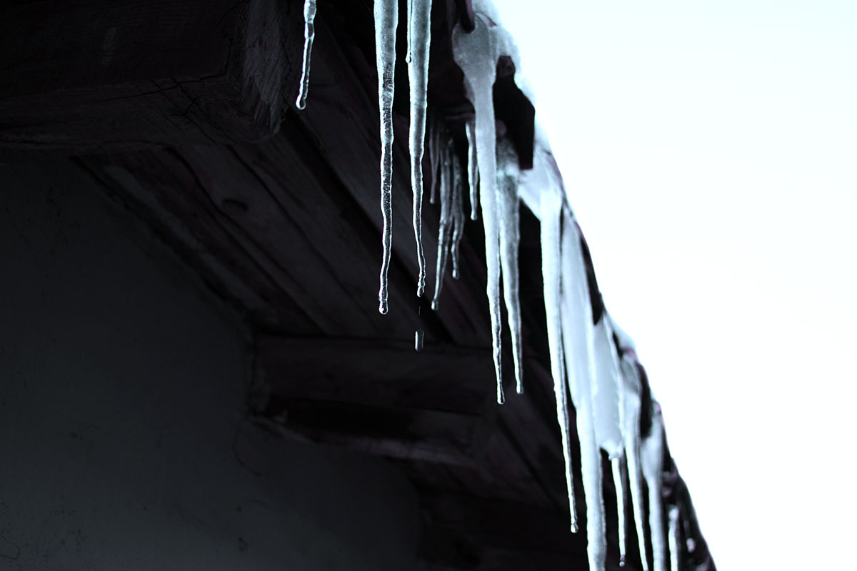 Icicles forming on a roof edge.